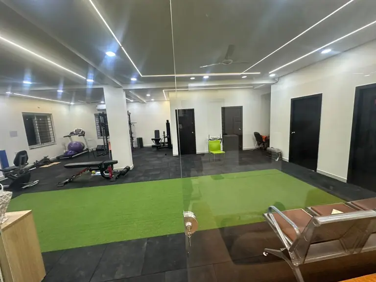 Rehab gym with turf track for sports and gait training