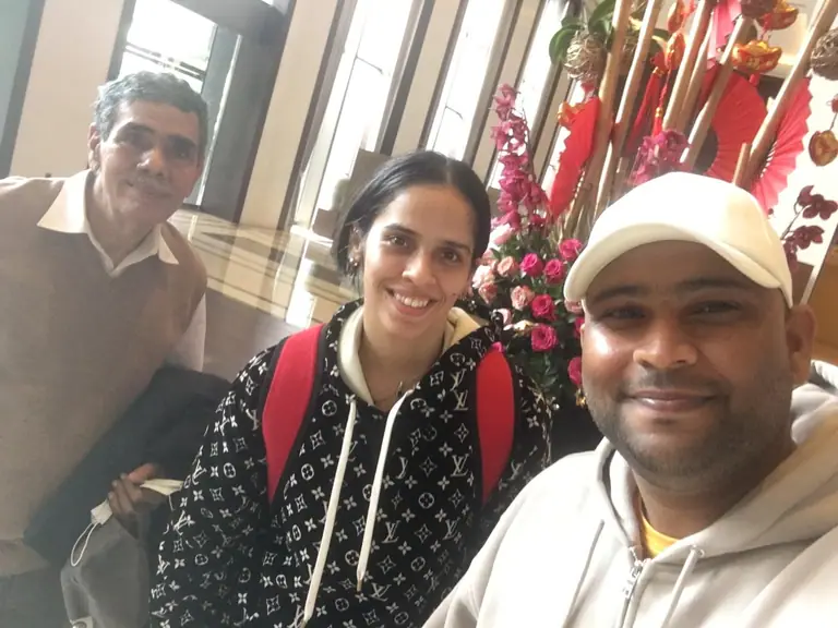 Dr. M Mahammad Ilias with an athlete and family